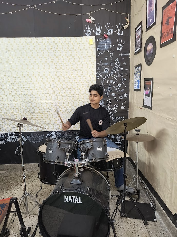 Aayush Dixit playing a drum kit